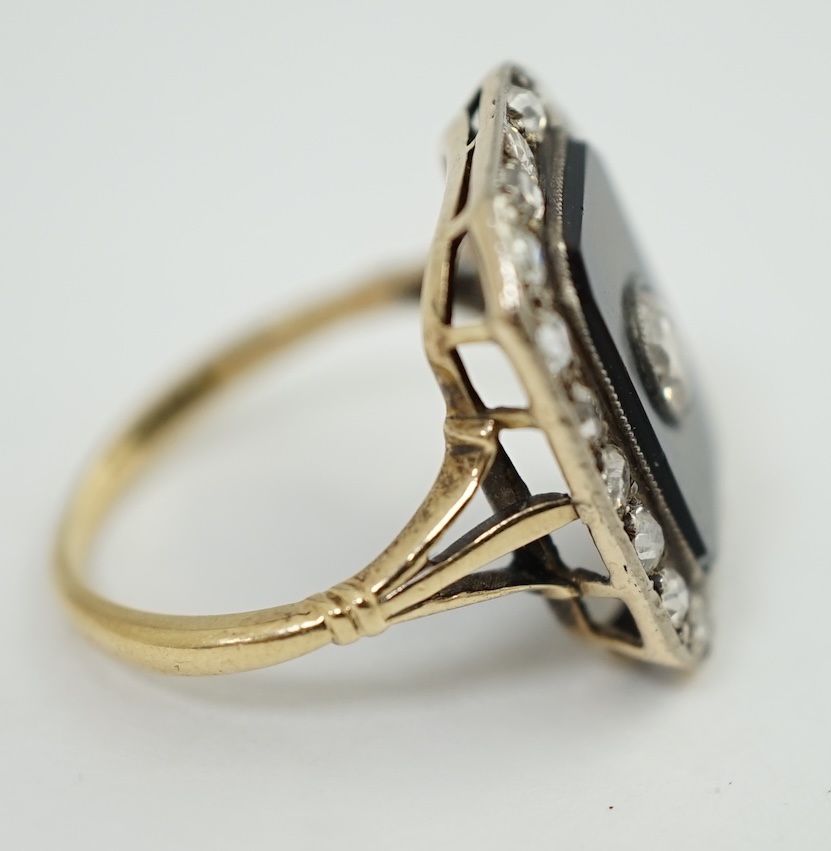 A 1940's? gold, black onyx and diamond cluster set tablet ring